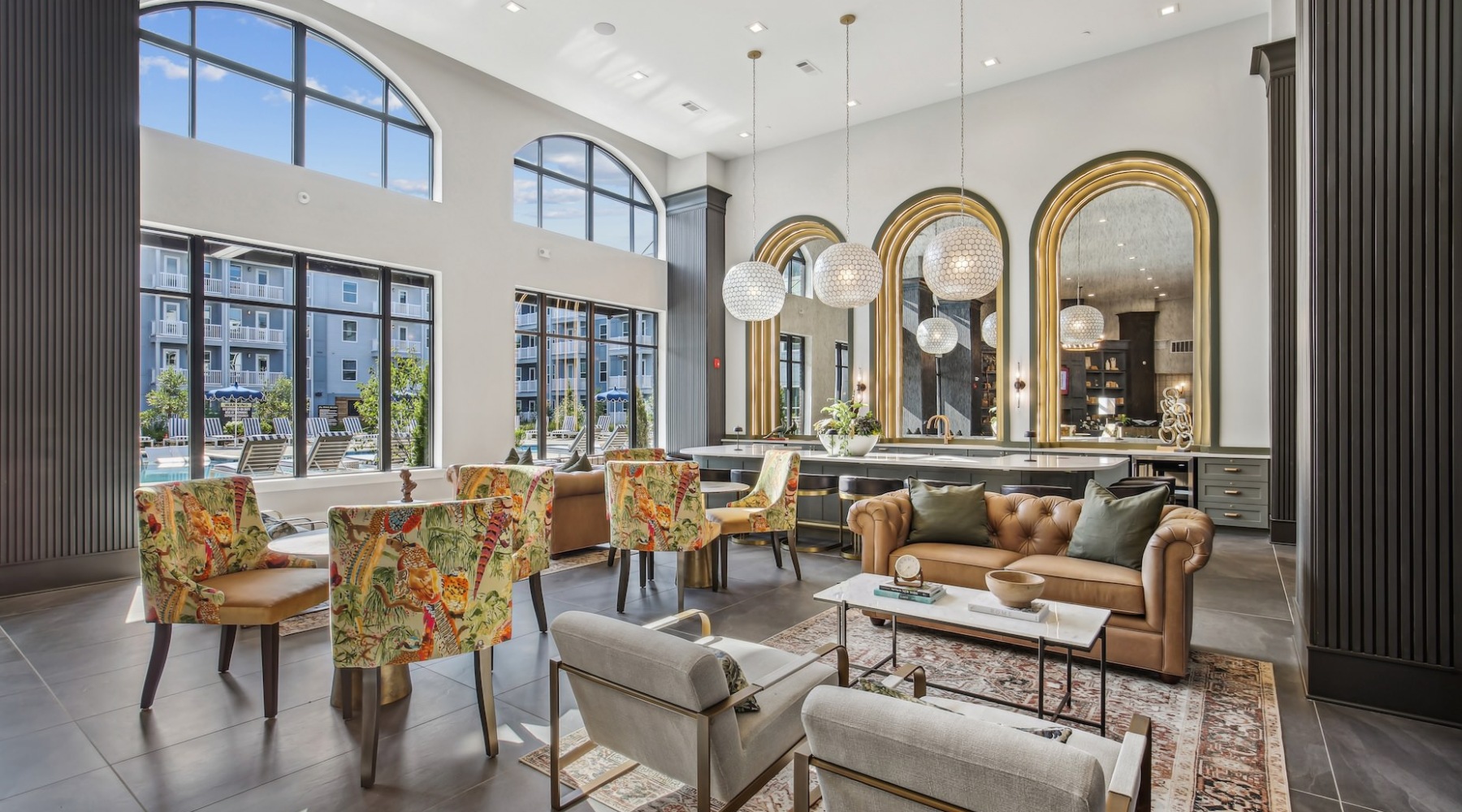 Upscale resident clubhouse with large windows and comfortable seating at The Lacy at South Main Kennesaw apartments