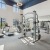 Fitness center with cardio equipment and natural light