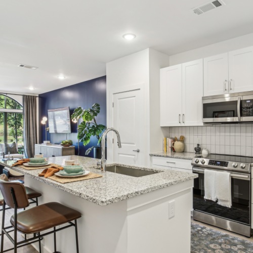 Kitchen with gooseneck faucet and side by side fridge  Kitchen with gooseneck faucet and side by side fridge